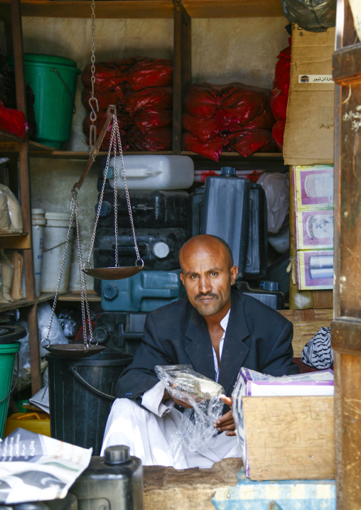 Yemeni man in a buckets shop, Amanat Al-Asemah, Sanaa, Yemen