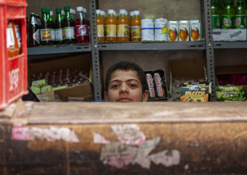Yemeni boy in a shop, Amanat Al-Asemah, Sanaa, Yemen
