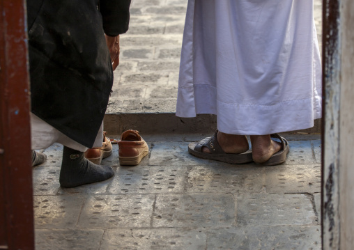 Muslims removing shoes in mosque, Amanat Al-Asemah, Sanaa, Yemen