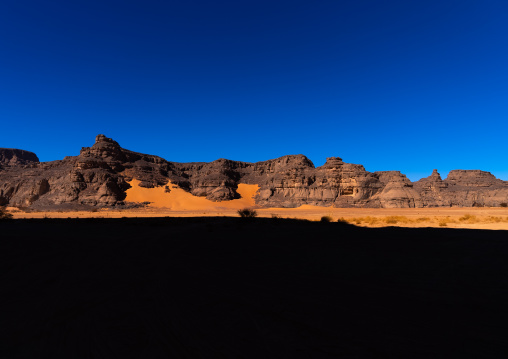 Rocks and sand dunes in Sahara desert, Tassili N'Ajjer National Park, Tadrart Rouge, Algeria