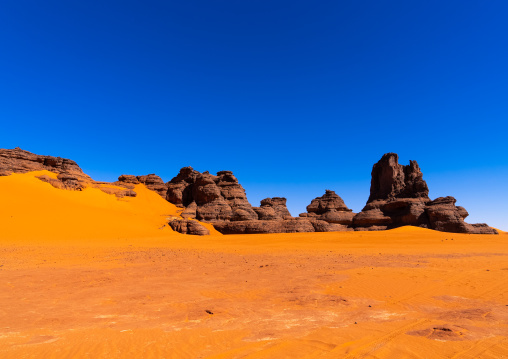 Rocks and sand dunes in Sahara desert, Tassili N'Ajjer National Park, Tadrart Rouge, Algeria