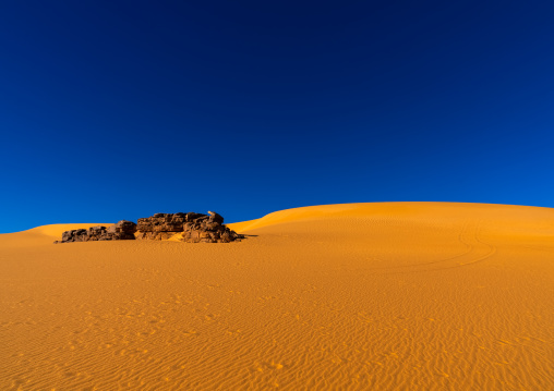 Rocks and sand dunes in Sahara desert, North Africa, Erg Admer, Algeria