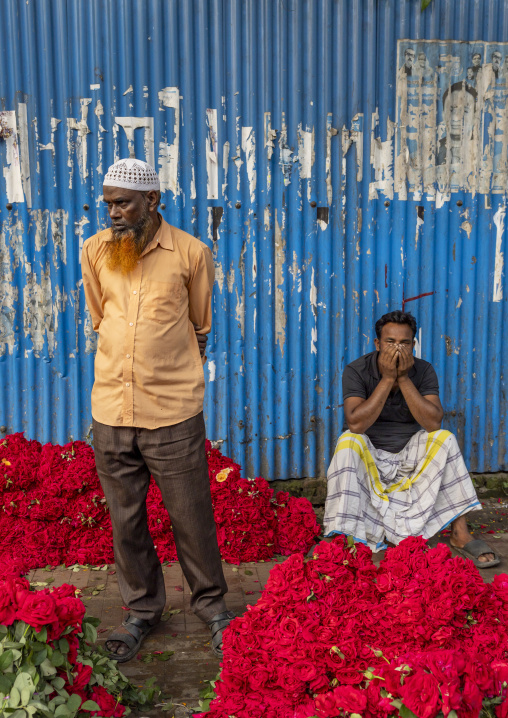 Bangladeshi men selling red roses at flower market, Dhaka Division, Dhaka, Bangladesh