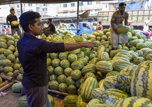 Bangladeshi man selling watermelons at Kawran Bazar market, Dhaka Division, Dhaka, Bangladesh