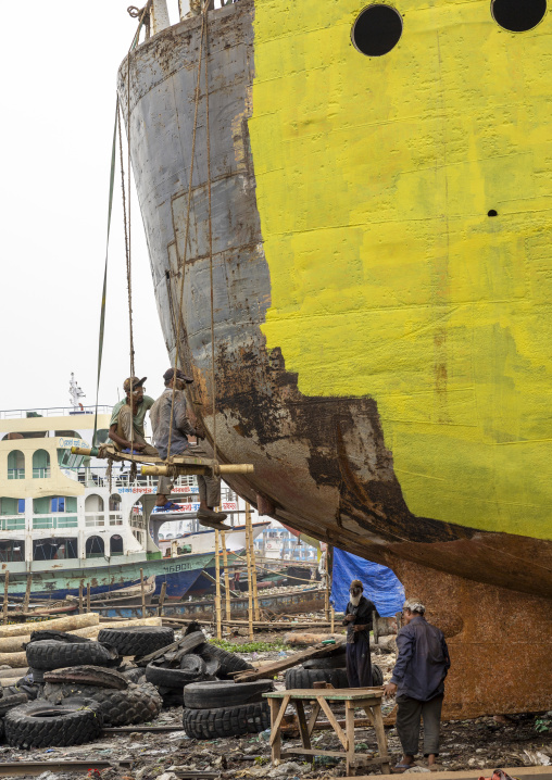 Painters painting ship at shipyard, Dhaka Division, Keraniganj, Bangladesh