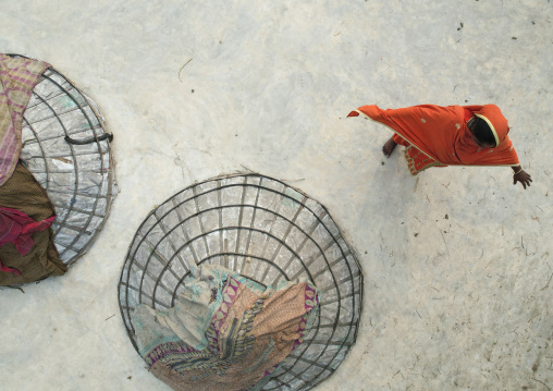 Aerial view of mounds of rice with giant hat-shaped bamboo cones, Chittagong Division, Ashuganj, Bangladesh