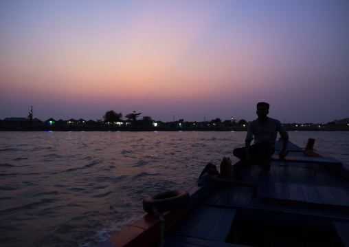 Local boat on a river at sunset, Khulna Division, Shyamnagar, Bangladesh