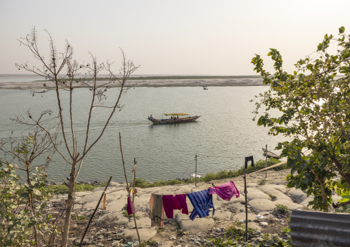 Local boat on a quiet river, Rajshahi Division, Rajshahi, Bangladesh
