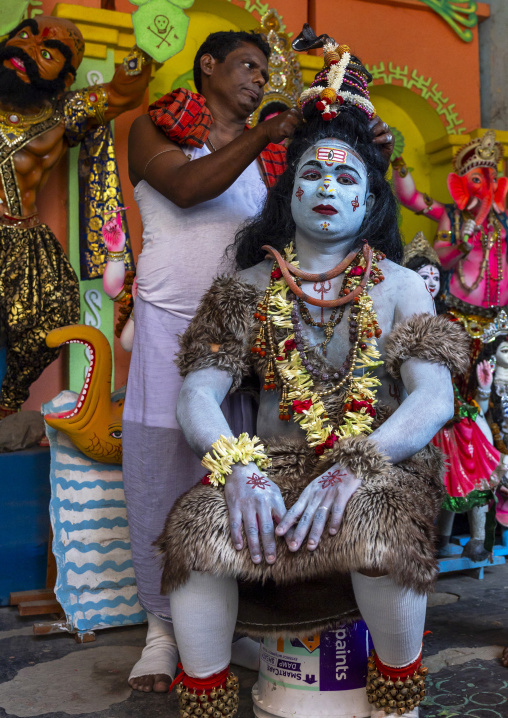Preparation of a hindu devotee who becomes Lord Shiva at Lal Kach festival, Dhaka Division, Munshiganj Sadar, Bangladesh