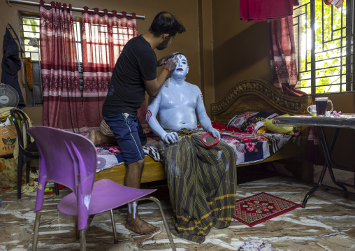 Make up of a hindu devotee who becomes Lord Shiva at Lal Kach festival, Dhaka Division, Munshiganj, Bangladesh