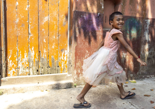 Bangladeshi girl with a ballerina dress in the street, Dhaka Division, Munshiganj, Bangladesh