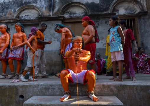 Hindu devotees with swords covered with orange color at Lal Kach festival, Dhaka Division, Munshiganj, Bangladesh