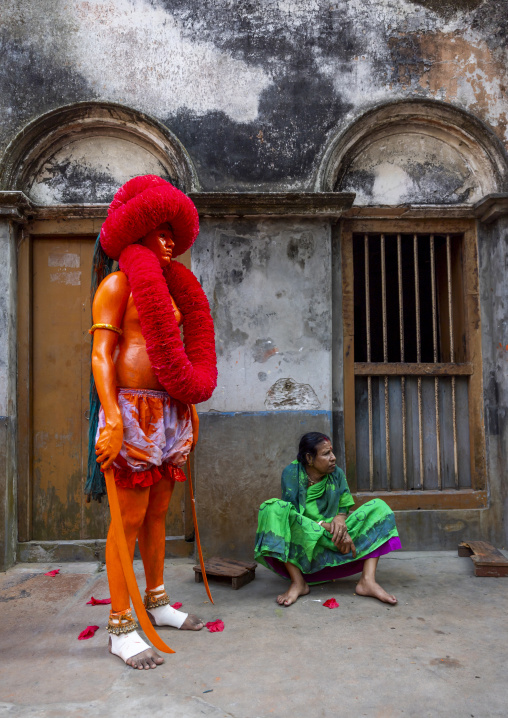 Hindu devotee covered with orange color at Lal Kach festival, Dhaka Division, Munshiganj, Bangladesh