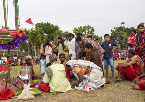 Devotees making offerings before body suspension during Charak Puja, Sylhet Division, Kamalganj, Bangladesh