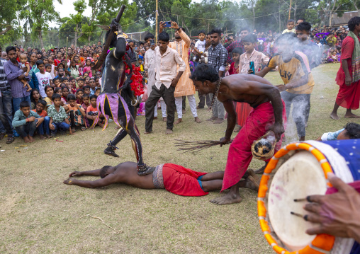 Kali standing on the back of lying man Charak Puja hindu festival, Sylhet Division, Kamalganj, Bangladesh