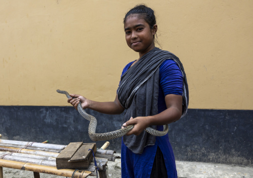 Gypsy woman with snake she rents for ceremonies, Chittagong Division, Bijoynagar, Bangladesh