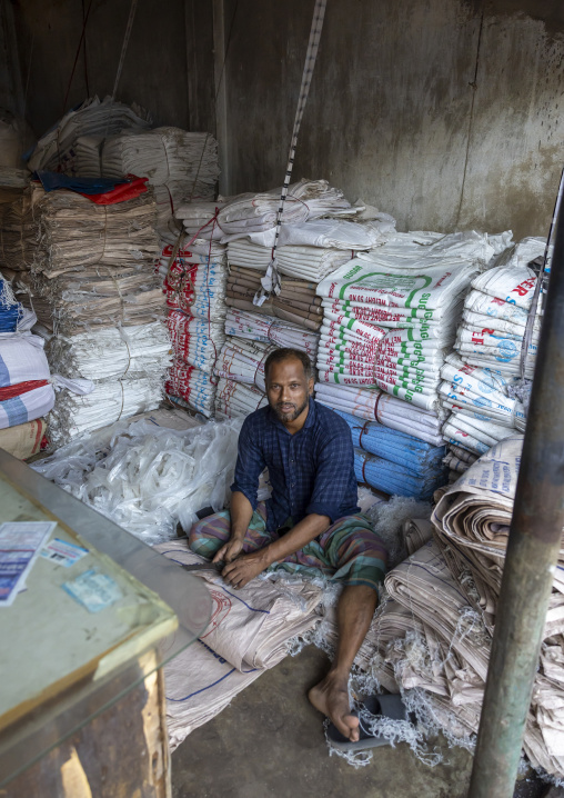 Bnagladeshi man recycling plastic bags in a factory, Chittagong Division, Chittagong, Bangladesh