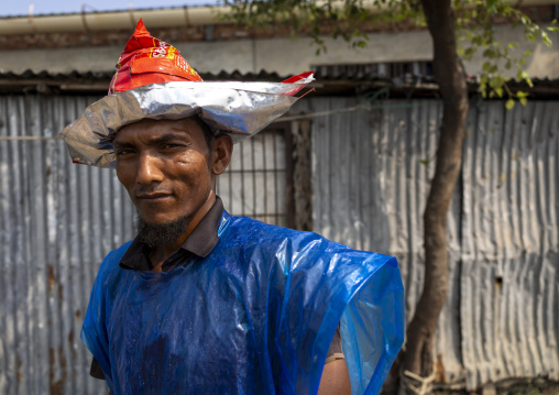 A bangladeshi porter at the morning fish market, Chittagong Division, Chittagong, Bangladesh