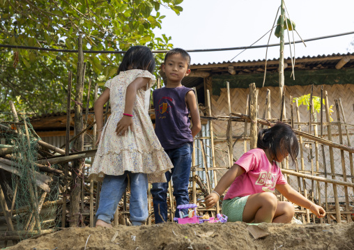 Tanchangya children playing in the street, Chittagong Division, Bandarban, Bangladesh