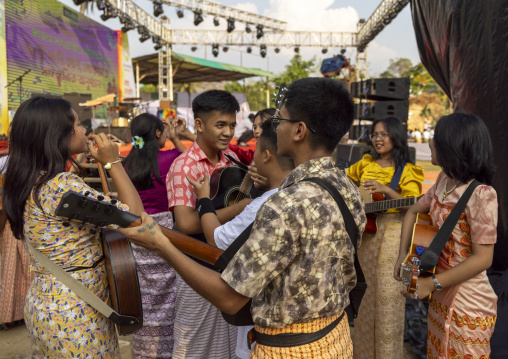 Marma ethnic group young people playing music during Sangrai festival, Chittagong Division, Bandarban, Bangladesh