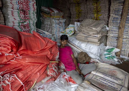 Bnagladeshi young man recycling plastic bags in a factory, Chittagong Division, Chittagong, Bangladesh