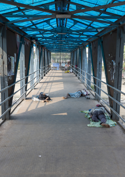 Bangladeshi people sleeping on the bridge in Sadaghat Launch Terminal, Dhaka Division, Dhaka, Bangladesh