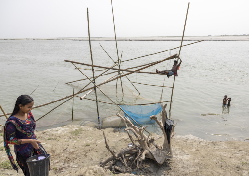 Traditional fishing net which functions on the principle of balance, Dhaka Division, Shivalaya, Bangladesh