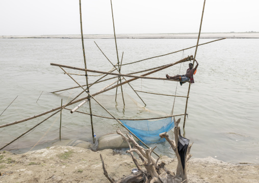 Traditional fishing net which functions on the principle of balance, Dhaka Division, Shivalaya, Bangladesh
