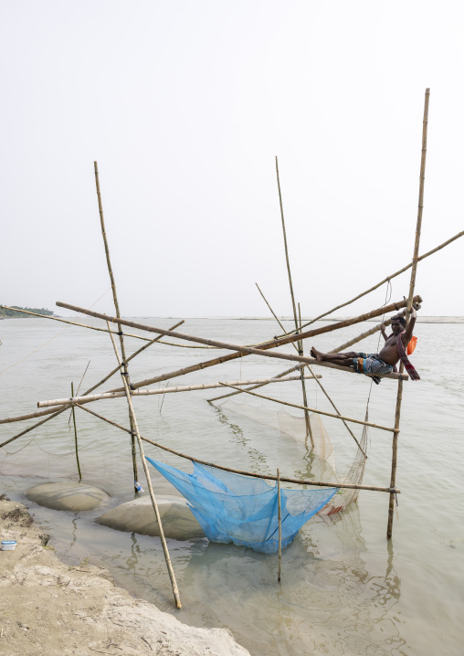 Traditional fishing net which functions on the principle of balance, Dhaka Division, Shivalaya, Bangladesh
