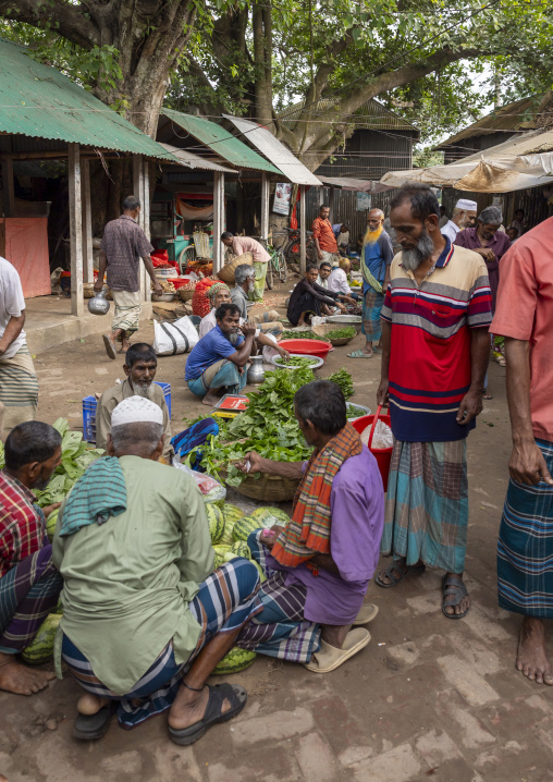 Bangladeshi men buying watermelons in a market, Dhaka Division, Dhamrai, Bangladesh