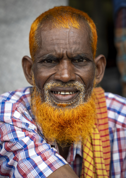 Bangladeshi man with beard and hair dyed in henna, Dhaka Division, Dhamrai, Bangladesh