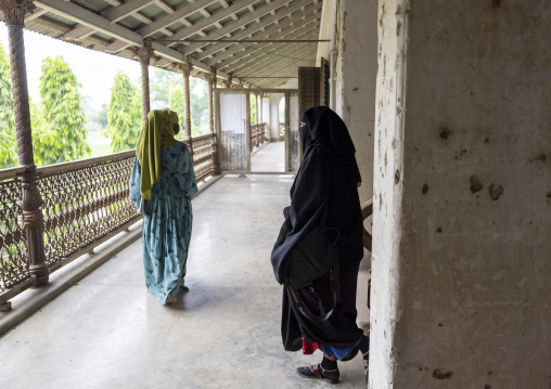 Veiled women in an heritage house at Pakutia Zamindar Bari, Dhaka Division, Nagarpur, Bangladesh