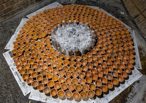 Clay pots around a bonfire to make traditional yogurt, Rajshahi Division, Bogura, Bangladesh