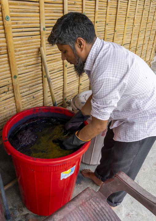Mister Massoud  dyeing fabrics with indigo in Living Blue company, Rangpur Division, Goalpara, Bangladesh