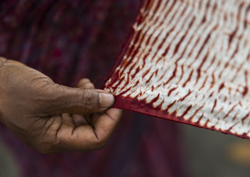 Shawl made with red tie-dye resist dyeing technique in Living Blue, Rangpur Division, Goalpara, Bangladesh