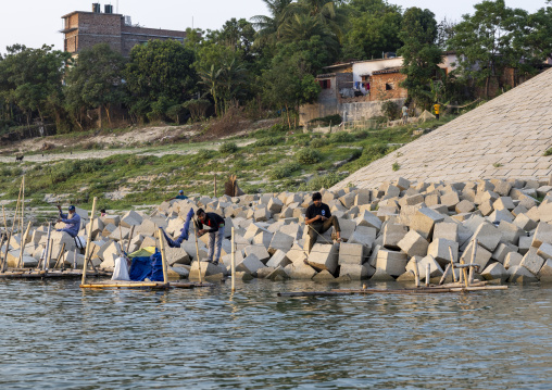 Bangladeshi men fishing on the riverbank, Rajshahi Division, Rajshahi, Bangladesh