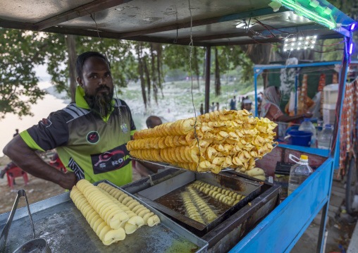 Bangladeshi man selling potatoes chips in a market, Rajshahi Division, Rajshahi, Bangladesh