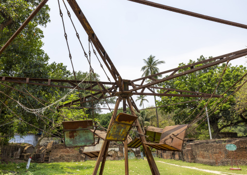 Old rusty merry-go-round in Natore Rajbari gardens, Rajshahi Division, Natore, Bangladesh