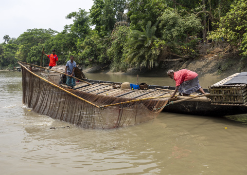 Bangladeshi fishermen use otters to fish in the Sundarbans, Khulna Division, Narail, Bangladesh