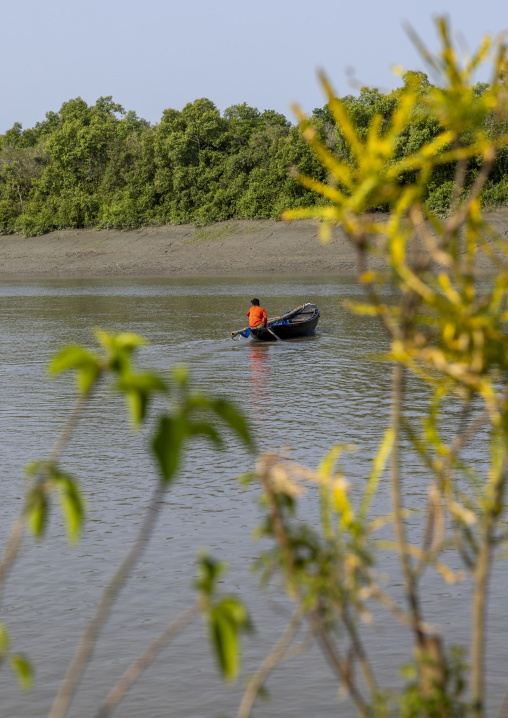 Man on a canoe on a river, Khulna Division, Mongla, Bangladesh