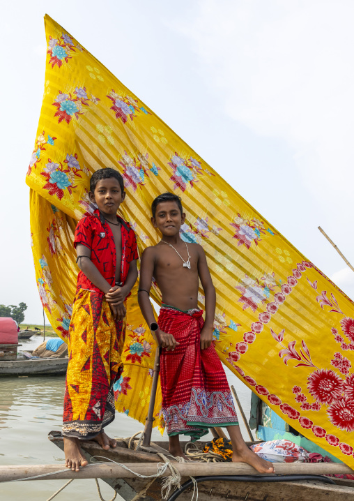 River gypsy boys living on a boat, Barisal Division, Barisal, Bangladesh