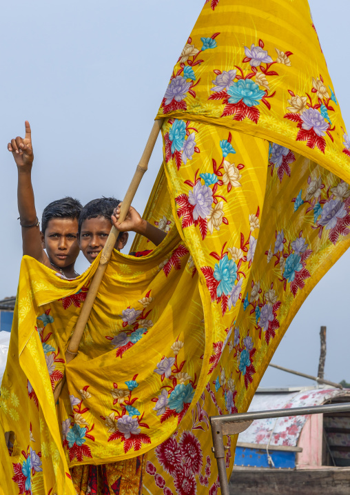 River gypsy boys living on a boat, Barisal Division, Barisal, Bangladesh