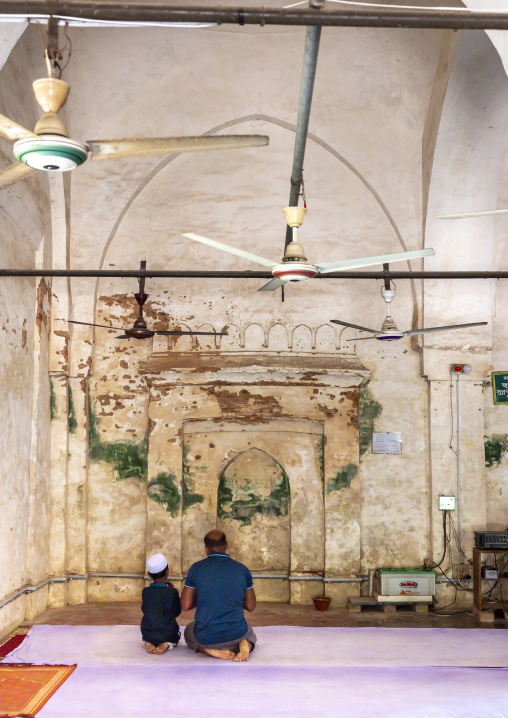 Father and son praying inside Qasba Mosque, Barisal Division, Gournadi, Bangladesh