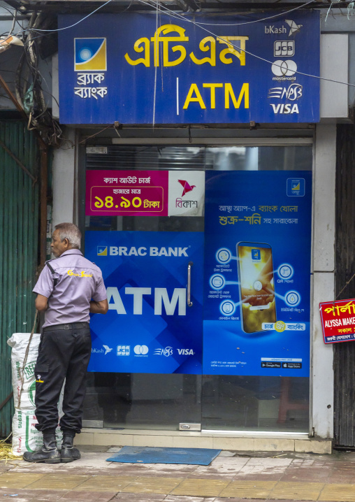 Bangladeshi guard in front of Brac bank Atm machine, Dhaka Division, Dhaka, Bangladesh