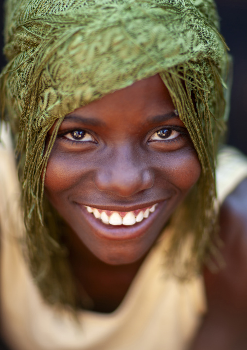 Portrait of a smiling mudimba  tribe girl, Cunene province, Cahama, Angola
