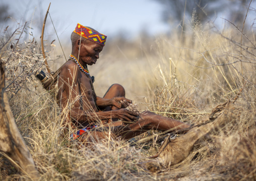 Old san tribe man with his bow, Otjozondjupa, Tsumkwe, Namibia