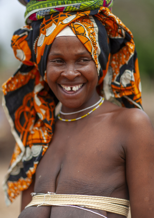 Smiling Mucubal tribe woman wearing the oyonduthi bra, Namibe Province, Virei, Angola