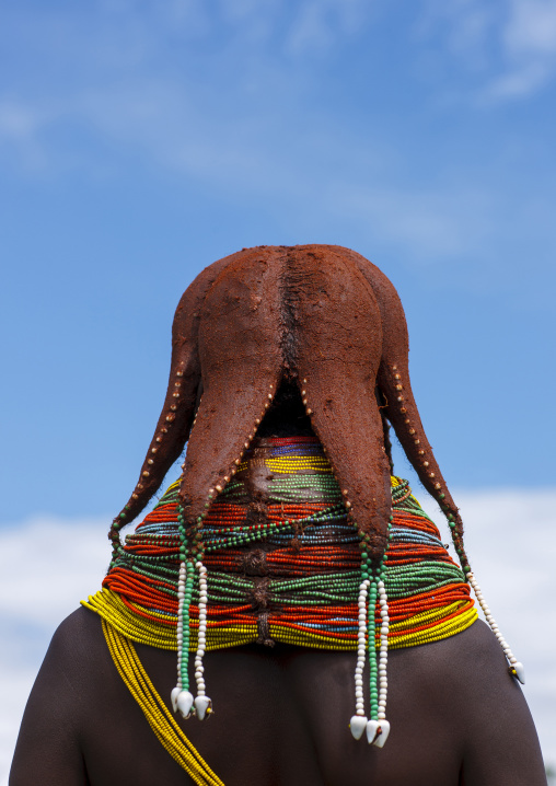 Rear view of a Mwila tribe woman with vilanda necklaces, Huila Province, Chibia, Angola