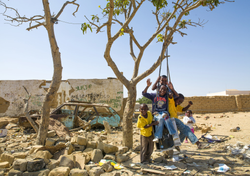 Children having fun on a swing, Namibe Province, Namibe, Angola