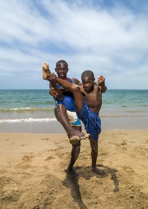Boys dancing capoeira on the beach, Namibe Province, Namibe, Angola